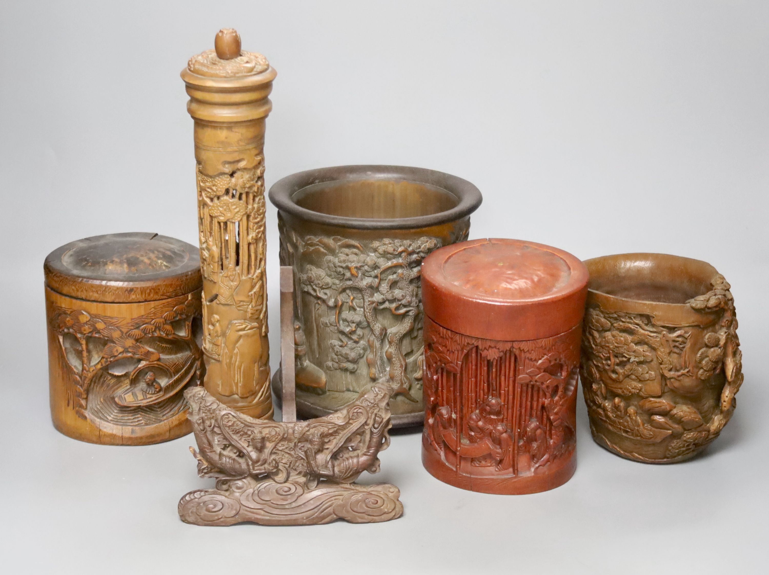 Three Chinese carved bamboo brushpots, largest 16cm diameter 17cm high, together with a carved bamboo scroll box and a carved hardwood plate stand (6)